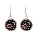 Pair of earrings with sun and moon designs on a white background