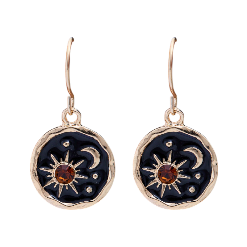 Pair of earrings with sun and moon designs on a white background