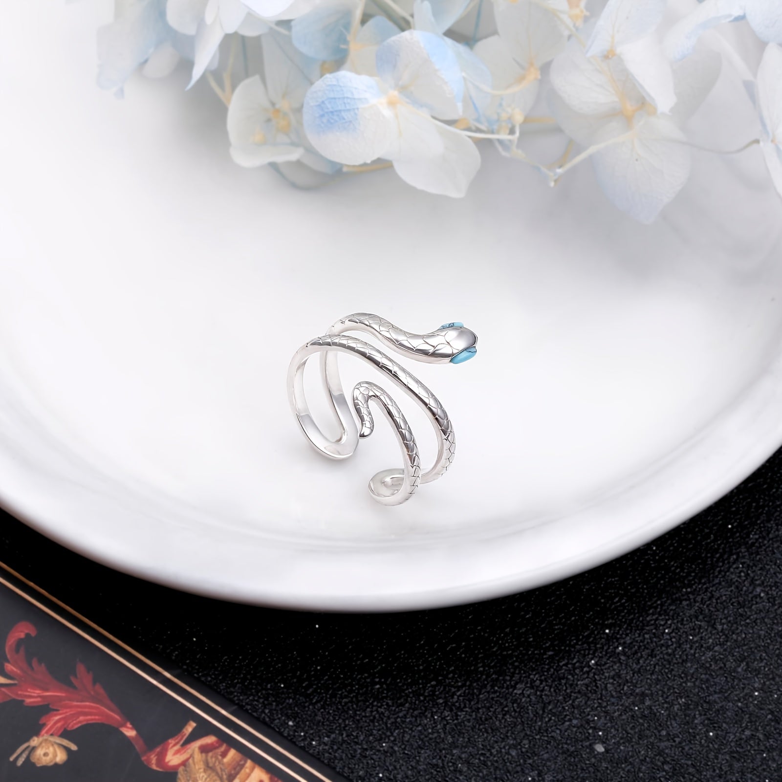 Adjustable S925 sterling silver snake ring with turquoise eyes.