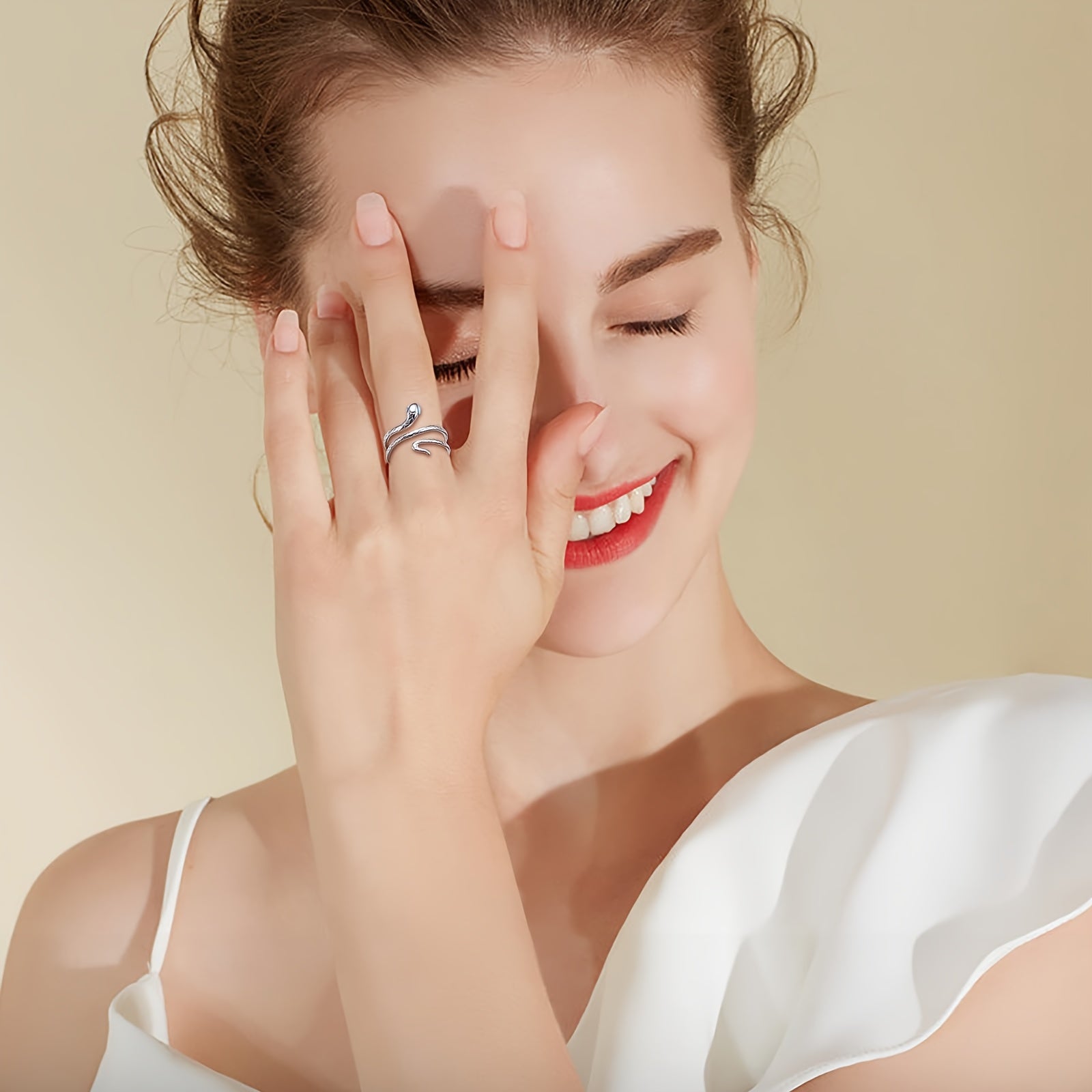 Adjustable S925 sterling silver snake ring with turquoise eyes.