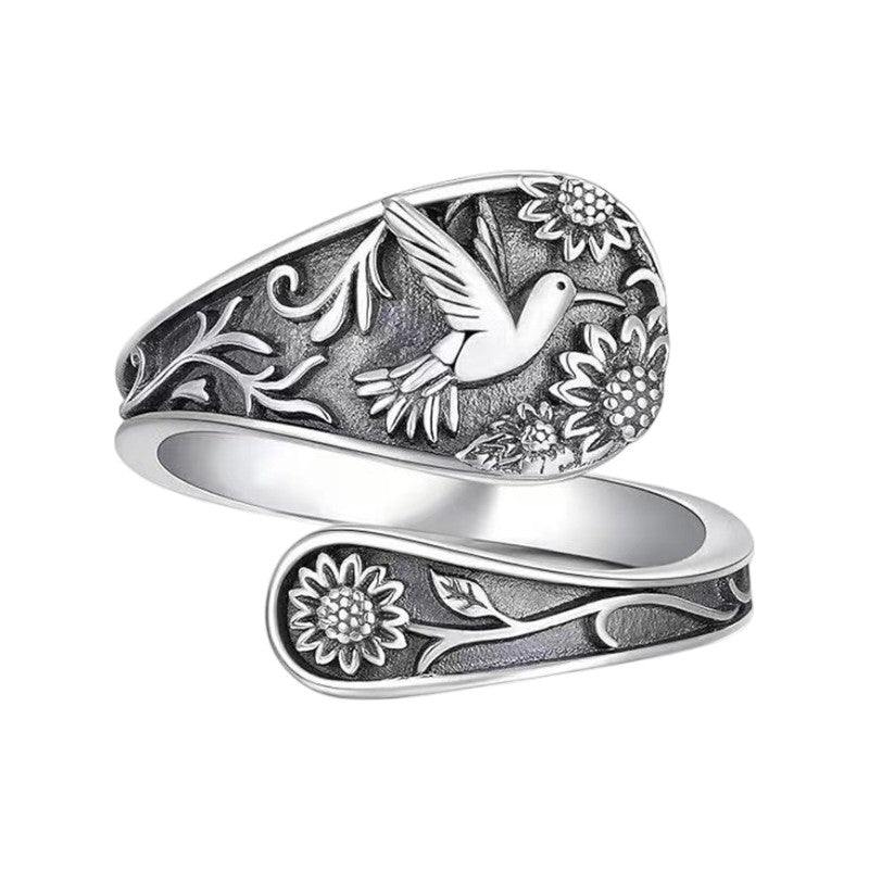 Vintage S925 sterling silver bohemian ring with engraved bird and floral details.