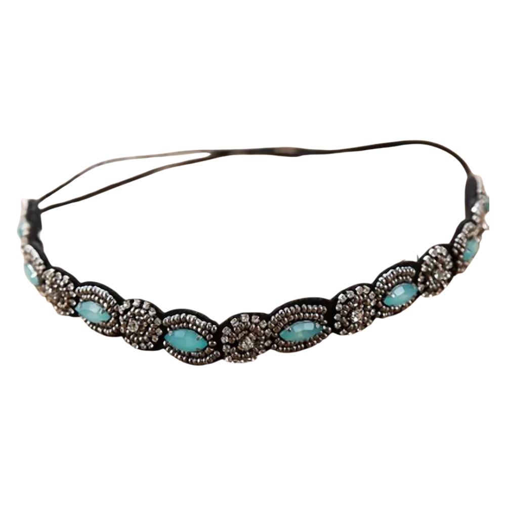 Decorative headband with turquoise stones and metallic accents on a white background