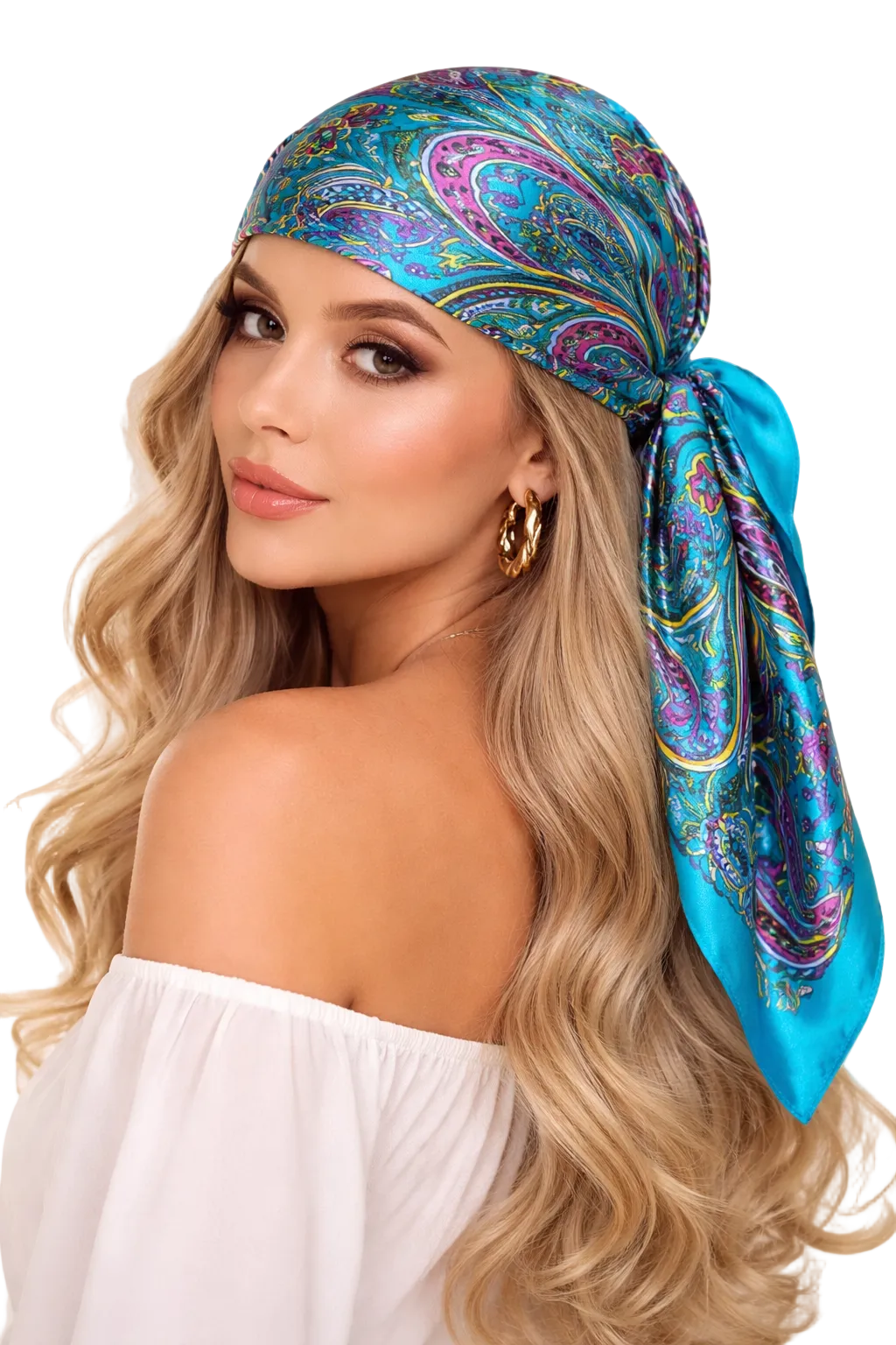 Woman wearing a colorful headscarf with a white top against a neutral background